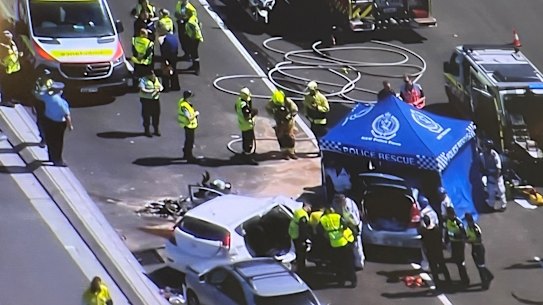 One person is dead after a bus and three cars collided on Sydney Harbour Bridge.