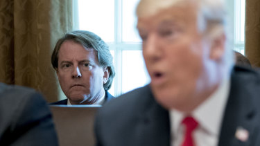 White House counsel Don McGahn, pictured with Donald Trump, will leave his job in the coming weeks.