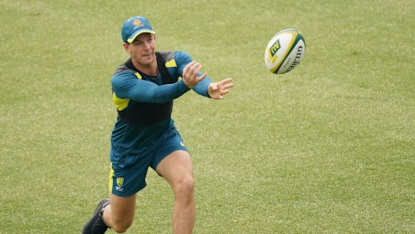 Tim Paine switches codes briefly during Australian training in Sydney on Wednesday.