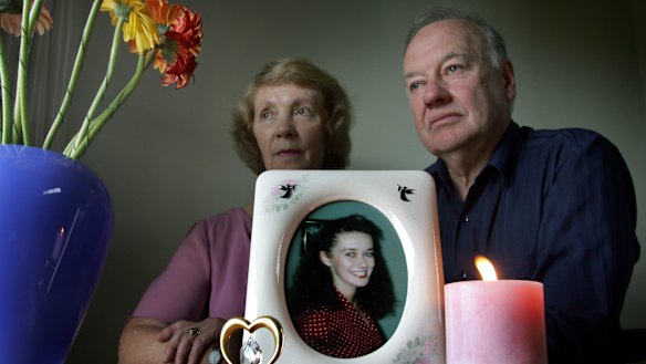 Joy and Roger Membrey in 2005, with a picture of their daughter Elisabeth, who was killed in 1994. There is a $1 million reward for information on her murder.
