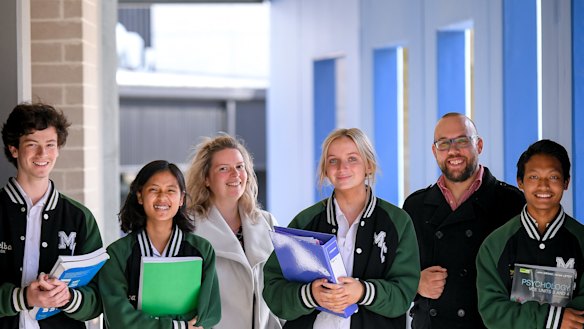 The Age has awarded Melba College its 2021 Schools that Excel government school winner for Melbourne’s east. Students Harry Pearson, Hser Tin, Gemma van Rooy and Thang Zathang, L to R, and assistant principal Allirra Scott with acting principal Matt Lee.