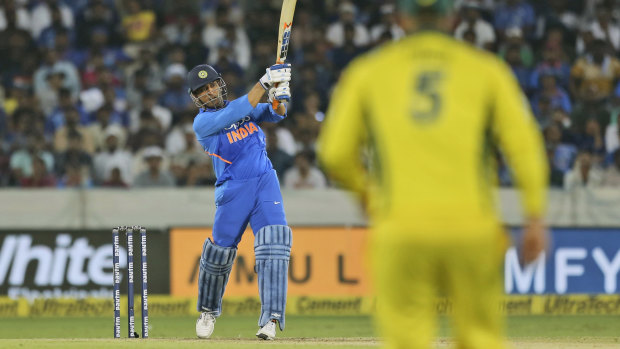 Soaring: Veteran MS Dhoni proved a thorn in Australia's side once again.