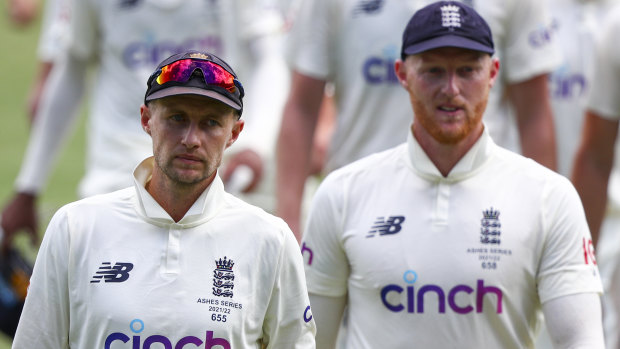 Joe Root and Ben Stokes trudge off the Gabba after the first Test.
