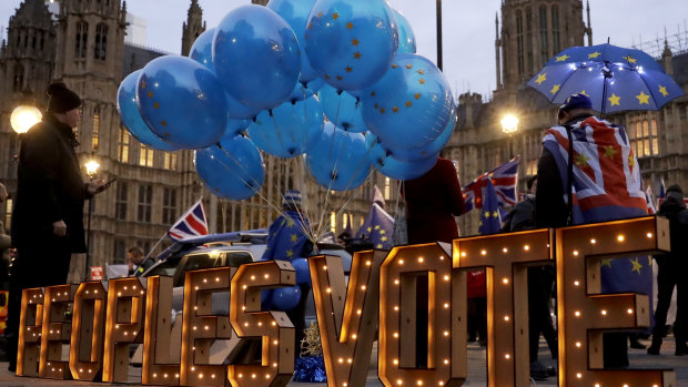 The words "Peoples Vote" call for another referendum on Brexit across the street from the Houses of Parliament in London on Monday.