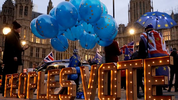 The words "Peoples Vote" call for another referendum on Brexit across the street from the Houses of Parliament in London on Monday.