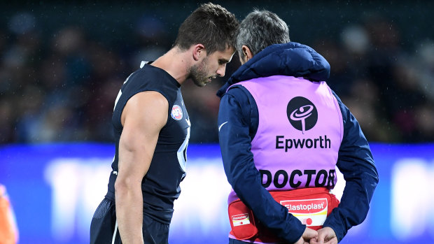 Carlton's Marc Murphy chats to the club doctor on Saturday night.
