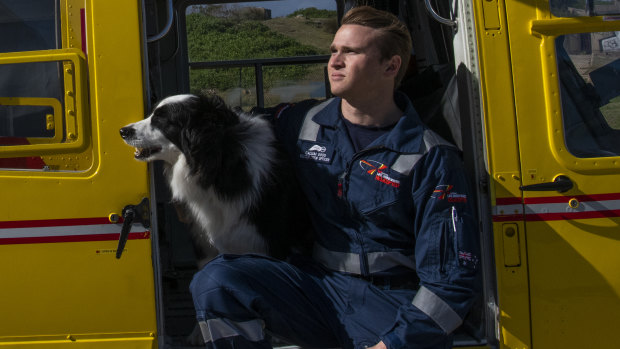 "The work that we do for the community is vital" Rescue diver Callum Good, at the Westpac Life Saver Rescue Service base in La Perouse with the base's dog, Whiskey.