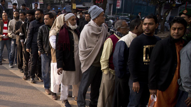 The line of voters outside a polling station in Dhaka, Bangladesh on Sunday.