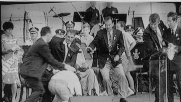 From left, a policeman, then-NSW premier John Fahey and Ian Kiernan rush to subdue an attacker as Prince Charles, right, is ushered away by a security man during an event at Darling Harbour in January 1994.
