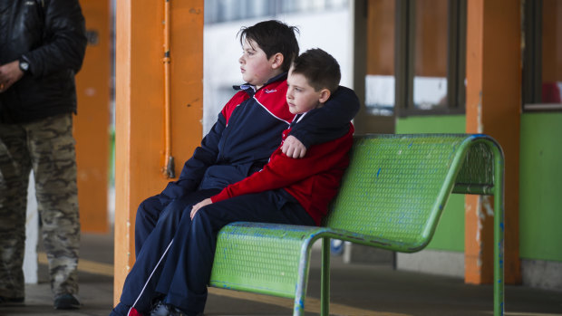 Noah Sham, 10, and Elijah Sham, 7, of Brindabella Christian College would have had to get on a public bus and make multiple connections to get to school from the Woden bus interchange under the new network.