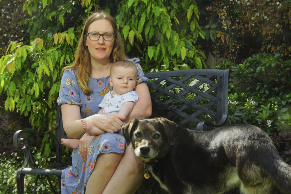 Sara Amos with son Heath (six months). Amos says of 10 close friends who had all taught together, only three are still teaching.