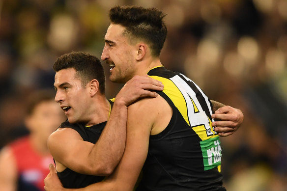 Jack Graham (left) and Ivan Soldo of the Tigers react after Graham kicked a goal.