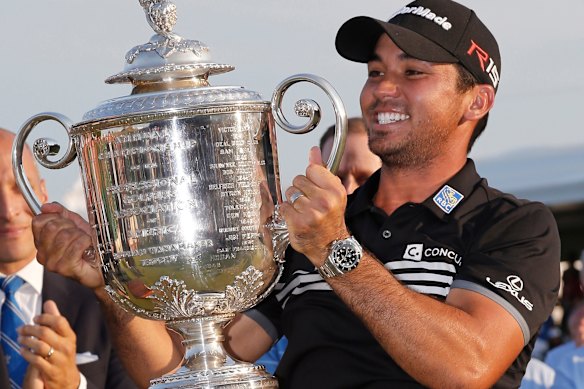 Jason Day lifts the Wanamaker trophy after winning the 2015 PGA Championship.