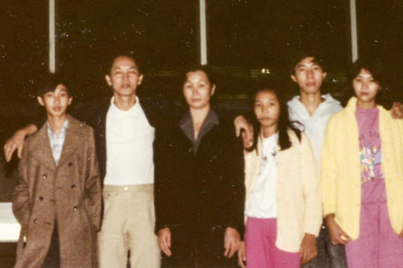A 16-year-old Dung Nguyen, far left, with his parents and siblings, arriving at Tullamarine Airport. 