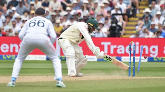Robinson knocks over Khawaja.