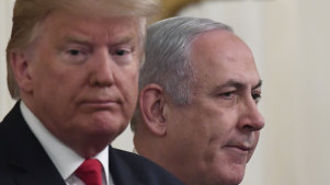 Benjamin Netanyahu applauds during Donald Trump's announcement.