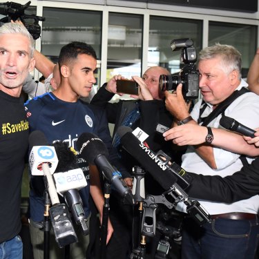 Craig Foster and media flank Hakeem al-Araibi on his return to Australia.