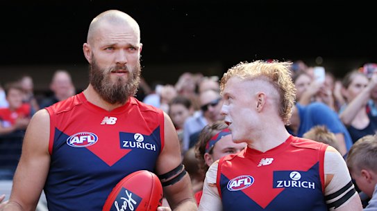 Melbourne captain Max Gawn with Clayton Oliver.
