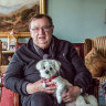 Harold Mitchell in his Melbourne apartment with his dog Lily. 