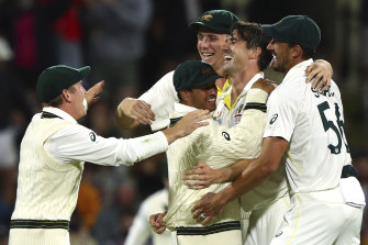 The Australians celebrate after completing their win.