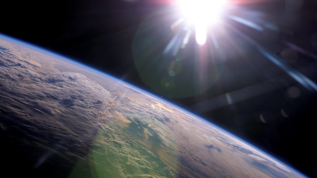 This image, taken from the International Space Station, shows the sun. Note how its light glows white, rather than yellow.