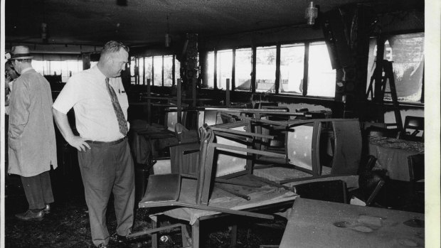 A detective examines the fire-damaged interior of the Whiskey Au Go Go nightclub on March 8, 1973