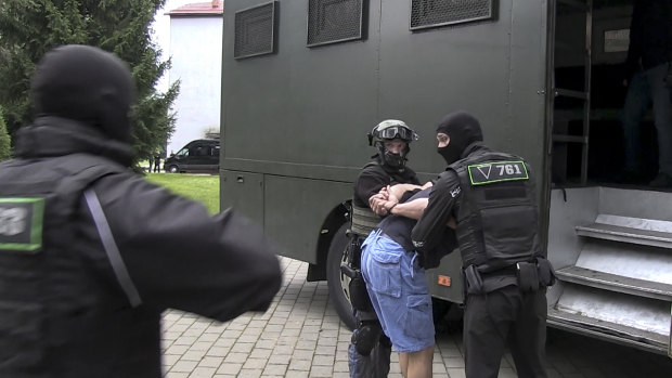 Belarusian KGB officers detain a Russian man in a sanitarium outside Minsk, Belarus. 