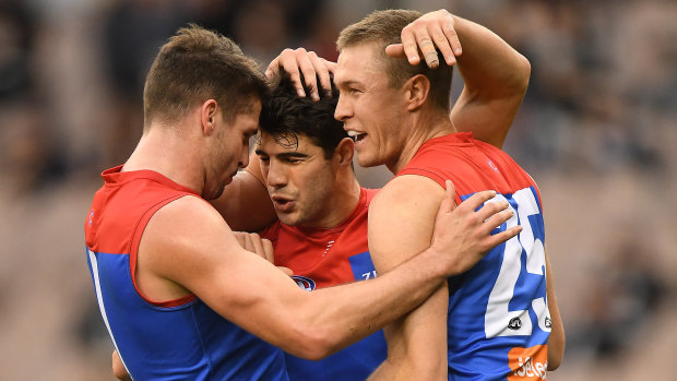 Too easy: Melbourne's Jesse Hogan, Christian Petracca and Tom MacDonald had a field day against Carlton.