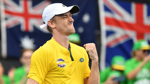 Millman celebrates winning his match against Felix Auger-Aliassime of Canada at Pat Rafter Arena in Brisbane.