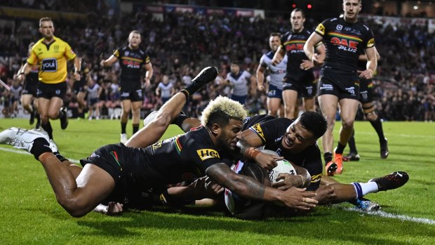 Not in my house ... Viliame Kikau, Tyrone May and Spencer Leniu deny the Storm centre.