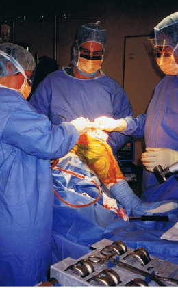 Merv Cross performing surgery in theatre.