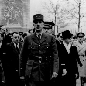 Charles de Gaulle walks down the Champs-Élysées after the liberation of Paris in August, 1944.