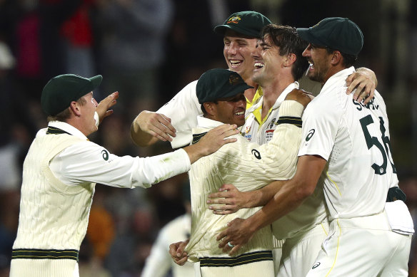 The Australians celebrate after completing their win.