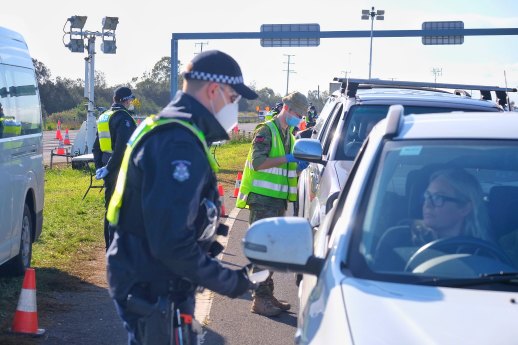 Police and ADF personnel at a checkpoint on Melbourne’s outskirts in July last year.