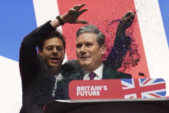 Keir Starmer is showered in glitter at the Labour Party conference in Liverpool.