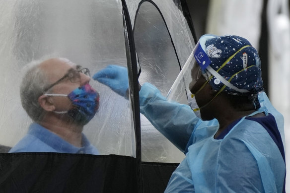 A man is tested for COVID-19 in downtown Miami this week.