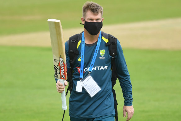The new normal: David Warner wears a mask during a net session in Southampton. 