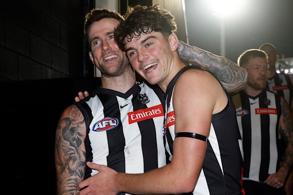 For old and for young: Veteran Magpies star Jeremy Howe with debutant Sam Swadling after their win over the Power.
