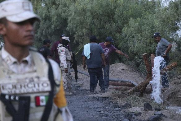 Volunteers drain water from a flooded and collapsed coal mine in Mexico.