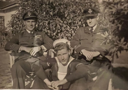 Arthur (centre) as a RAN radar operator with his brothers Alan and Ian Wyndham.