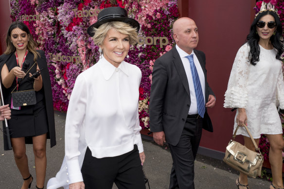 Packing black: Former foreign minister Julie Bishop makes her way to the Birdcage.
