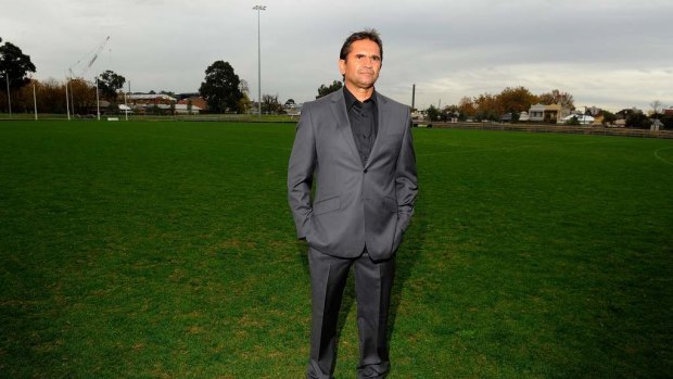 Nicky Winmar stands on the patch of ground at Victoria Park where the picture was taken of him pointing to the colour of his skin, at the launch of the 2013 AFL Indigenous Round.