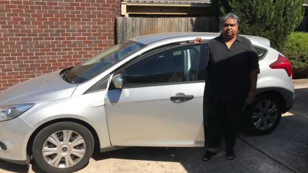 Nalini Devi Thiruvangadam with the car she bought that triggered a downward financial spiral.