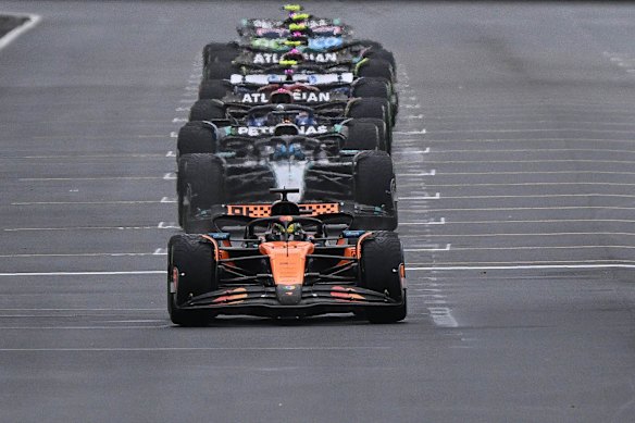 Cars line up on the grid for the start of the race.