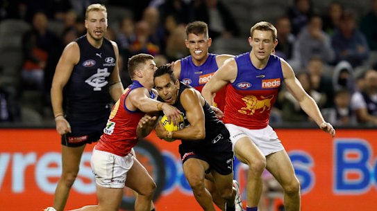 Eddie Betts is tackled by Dayne Zorko of the Lions on Saturday.
