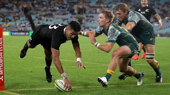 Rieko Ioane of the All Blacks scores a try.