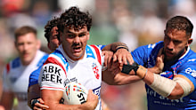 Herbie Farnworth tries to beat the French defence. 