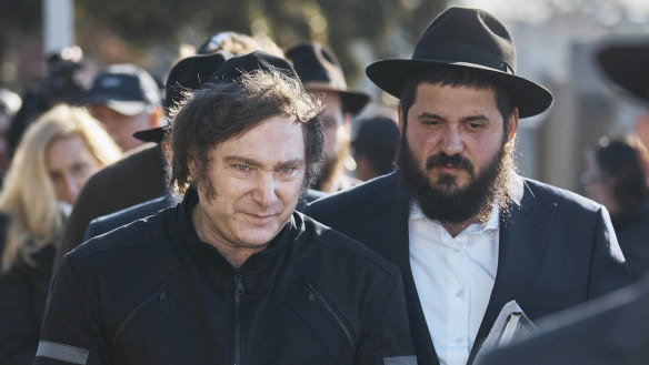 Argentina’s president-elect, Javier Milei, centre, leaves after praying next to Chabad-Lubavitch rabbis at the resting place of the Rebbe, Rabbi Menachem Mendel Schneerson at Montefiore Cemetery in New York.