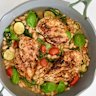 White beans and seasonal vegies add substance to this one-pan chicken dish.