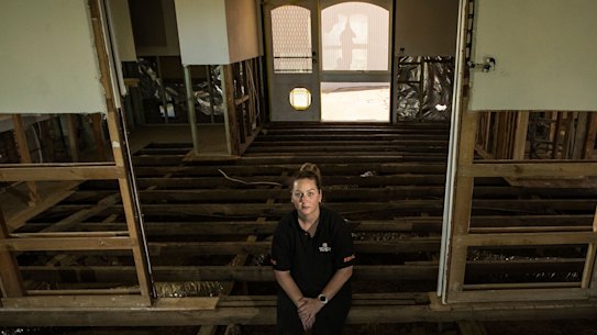 Seymour small business owner Courtney Carroll’s home is still uninhabitable 15 months after the October 2022 floods. 